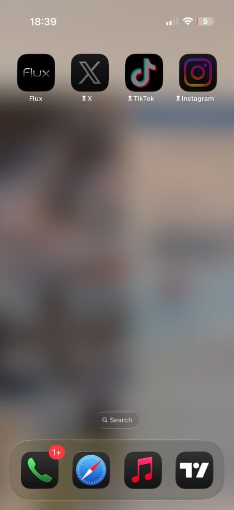 iPhone home screen showing Flux and blocked apps